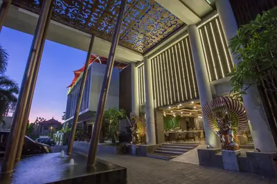 a building with columns and a building with a building at The Lerina Hotel Nusa Dua in Nusa Dua