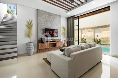 a living room with a couch and a tv at Verde Villa by Kozystay - Umalas in Kerobokan
