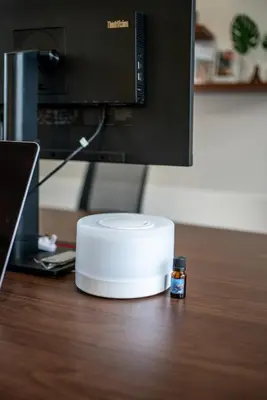 a white router sitting on a desk in front of a monitor at Promo!! New Rosa Villa Muding, Luxury and cozy 3Bedrooms Villa in Heart of Kerobokan with Special Office Room in Kerobokan