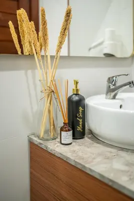 a bathroom counter with two bottles of soap and a sink at Promo!! New Rosa Villa Muding, Luxury and cozy 3Bedrooms Villa in Heart of Kerobokan with Special Office Room in Kerobokan