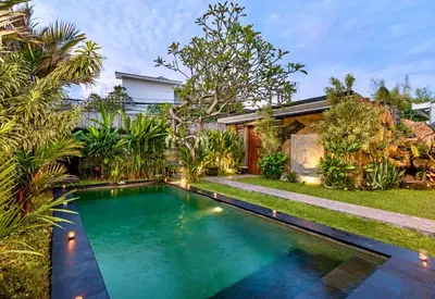 a swimming pool in the backyard of a house at Bens Tunjung Villa Two-Bedroom with Private Pool Kuta in Seminyak