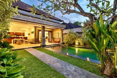 an external view of a villa with a swimming pool at Bens Tunjung Villa Two-Bedroom with Private Pool Kuta in Seminyak