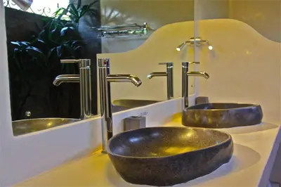 a bathroom with two sinks and two faucets at Villa Kija in Seminyak