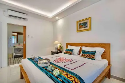 a bedroom with a large bed in a room at Bens Mertanadi Villa Two-Bedroom with Private Pool Kuta in Seminyak