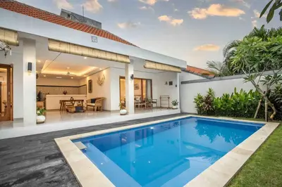 a swimming pool in the backyard of a house at Bens Mertanadi Villa Two-Bedroom with Private Pool Kuta in Seminyak