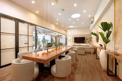 a dining room with a long table and chairs at CANGGU BRAND NEW 6Bed VILLA! BEST LOCATION! A STEP-FREE Design Highlight for Families & Friends in Canggu