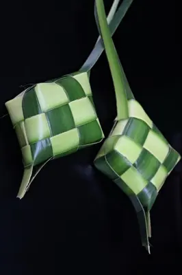 a green and white bow tie on a pair of scissors at CANGGU BRAND NEW 6Bed VILLA! BEST LOCATION! A STEP-FREE Design Highlight for Families & Friends in Canggu