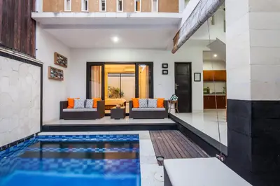 a swimming pool in the middle of a house at 4-BR Private Pool Legian Villa, 5-min walk to beach and shops in Seminyak