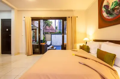 a bedroom with a large bed in a room at 4-BR Private Pool Legian Villa, 5-min walk to beach and shops in Seminyak