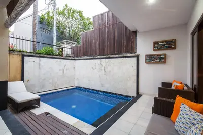 a swimming pool in the middle of a house at 10-BR Private Pool Legian Villa 5-Min Walk to Beach and Shops in Seminyak