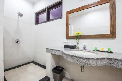 a bathroom with a sink and a mirror at 10-BR Private Pool Legian Villa 5-Min Walk to Beach and Shops in Seminyak