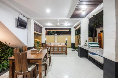 a dining room with a table and chairs at 10-BR Private Pool Legian Villa 5-Min Walk to Beach and Shops in Seminyak