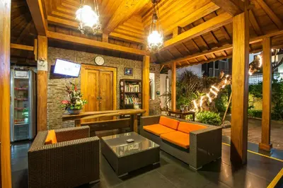 a living room with a couch and chairs and a tv at 7-BR Private Pool Legian Villa 5-Min Walk to Beach and Shops Bali in Seminyak