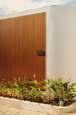 a bunch of plants in front of a building at Amethyst Villa Seminyak in Seminyak
