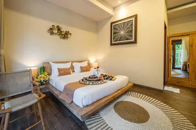 a bedroom with a large bed in a room at Arts Cherry Villa Dua Two-Bedroom with Private Pool Kuta in Kerobokan