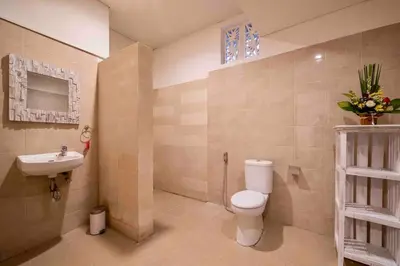 a bathroom with a toilet and a sink at Bens Bidadari Villa Two-Bedroom with Private Pool Kuta in Seminyak