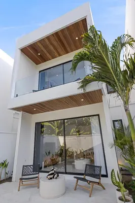 a modern house with a large glass facade at White Residence - Art & Boutique Villas in Seminyak