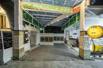 an entrance to a restaurant with a sign that reads seymour bake at Senyum Bali Inn 1BR Sanur in Sanur