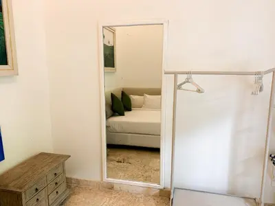a mirror in a room with a bed and a bedroom at Tropical Oasis 2 BR Villa - Near Beach in Seminyak