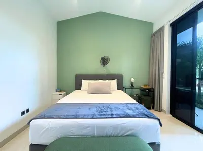 a bedroom with a large bed and a large window at Villa EM Umalas by Satran Villa in Kerobokan