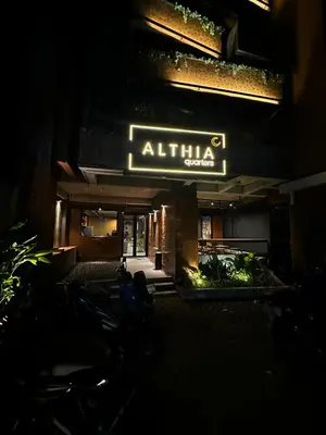 a building with a sign that reads atilla palace at night at Althia Private Capsule Quarters in Badung