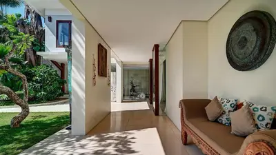 a hallway with a couch in a house at Casa Evaliza by Elite Havens in Seminyak