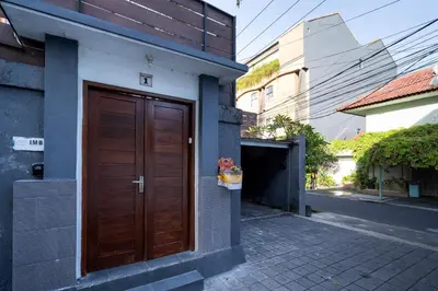 a brown door on the side of a building at Bali Huis Villa in Seminyak