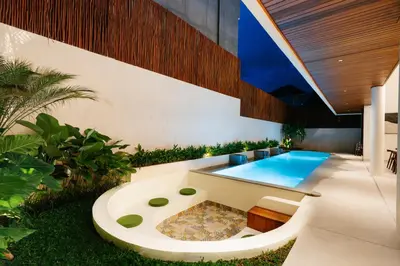 a swimming pool in the backyard of a house at Luxury Villa Noah in Kuta