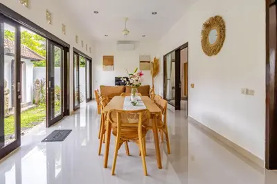 a dining room with a table and chairs at Gemstones Villa in Seminyak