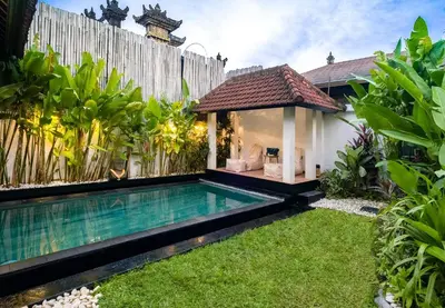 a swimming pool in the backyard of a villa at Gemstones Villa in Seminyak