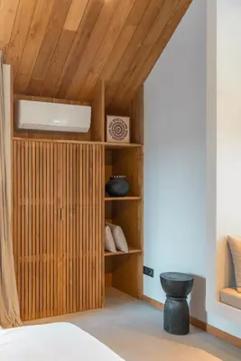 a room with a bed and a wooden ceiling at Vaya - Luxe & Stylish 3BR Villa Just Steps from the Beach in Seminyak