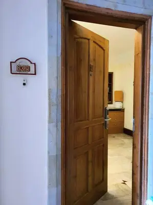 an open door to a room with a kitchen at C&C Apartment Jayakarta Residence Legian Bali A 6319 in Seminyak