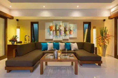 a living room with a couch and a coffee table at Villa Green Mango 2 Seminyak Bali in Seminyak