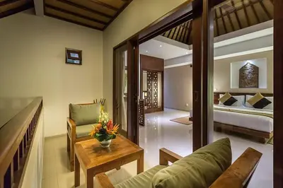 a living room with a couch and a bed at Villa Green Mango 2 Seminyak Bali in Seminyak