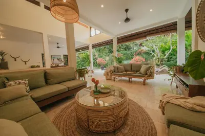 a living room with a couch and a table at Villa Eight in Seminyak