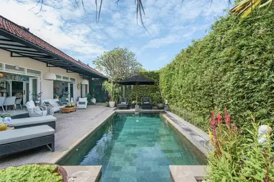 a swimming pool in the backyard of a house at Villa Bloom 3 - Coastal Beach Villa 2 brm Sleeps 4 SEMINYAK BEACH in Seminyak