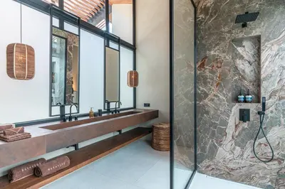 a bathroom with a sink and a shower at Villa Baratega - Dreamy Urban Tropical 6BR Villa for Large Group in Kerobokan