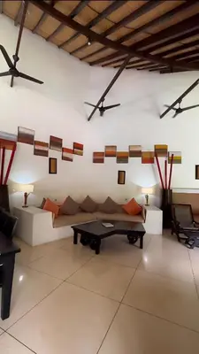 a living room with a couch and a table at Timang Villa, Jimbaran-Bali in Jimbaran