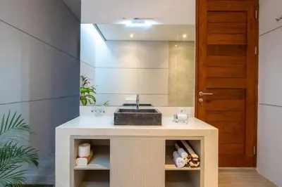 a bathroom with a sink and a mirror at Cozy villa in Umalas in Kerobokan