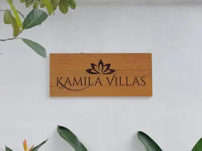 a sign that reads kamila villas on a wall at Private Pool Seminyak Central 2BR Villa in Seminyak
