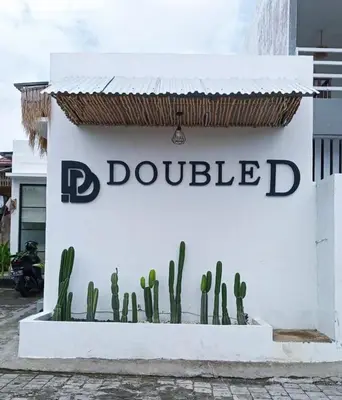a sign for a dolscribed with cactuses on it at Double D Guesthouse and Villa in Kerobokan