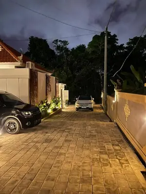 a car parked in a driveway next to a house at New 2BR Villa Private Pool Near Seminyak in Kerobokan