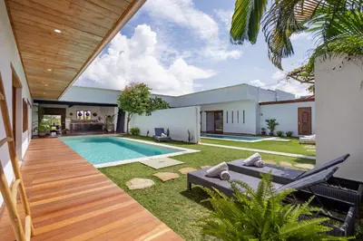 a swimming pool in the backyard of a house at Villa Jannu by DreamAwayBali in Seminyak