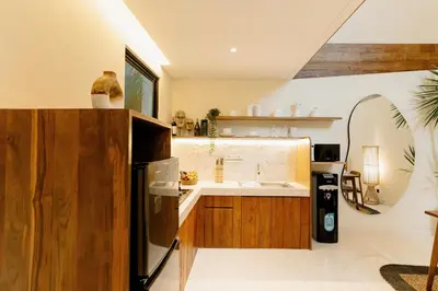a kitchen with a refrigerator and a sink at Balimac Villa 3 in Seminyak