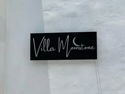 a sign on a wall that reads villa warfare at Nomadic LUX villa in Canggu