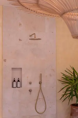 a bathroom with a shower with a shower head at Luxury 4BD Villa Casa Diplomatico with Private Pool in Seminyak