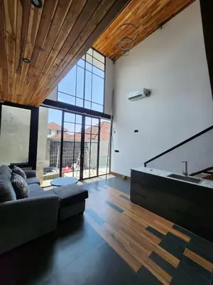 a living room with a couch and a sink at Felly House in Kerobokan