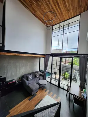 a living room with a couch and a table at Felly House in Kerobokan