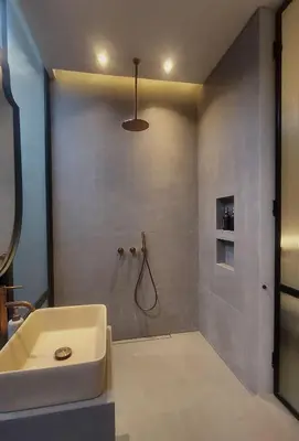 a bathroom with a white sink and a shower at Villa Gabrielle in Seminyak