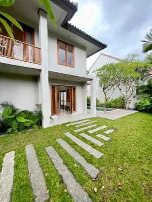 a house with a lawn in front of it at Villa Gabrielle in Seminyak